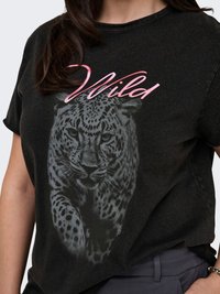 Black T-shirt with a leopard graphic in gray and pink, featuring the word "Wild." Short sleeves and a relaxed fit. Soft fabric texture.