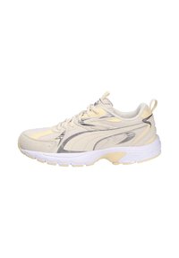 Light beige athletic shoe with a textured upper, silver accents, and a white midsole. Features laces and a pull tab at the heel.