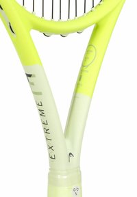 Bright yellow tennis racket featuring a curved handle, smooth finish, and printed branding details on the shaft. Strings are tightly woven at the head.