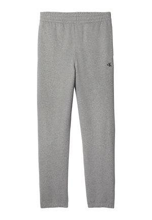 Pantalon de jogging gris clair à taille élastique avec petit logo noir « cK » sur la partie supérieure de la cuisse, jambes droites et poignets élastiques aux chevilles.