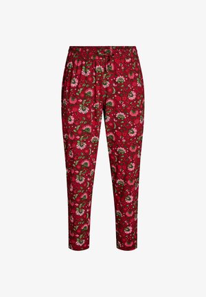 Punased lillemustriga püksid, millel on elastne vöökoht, mitmevärviliste lillemustrite ja roheliste lehtedega kogu kangal.