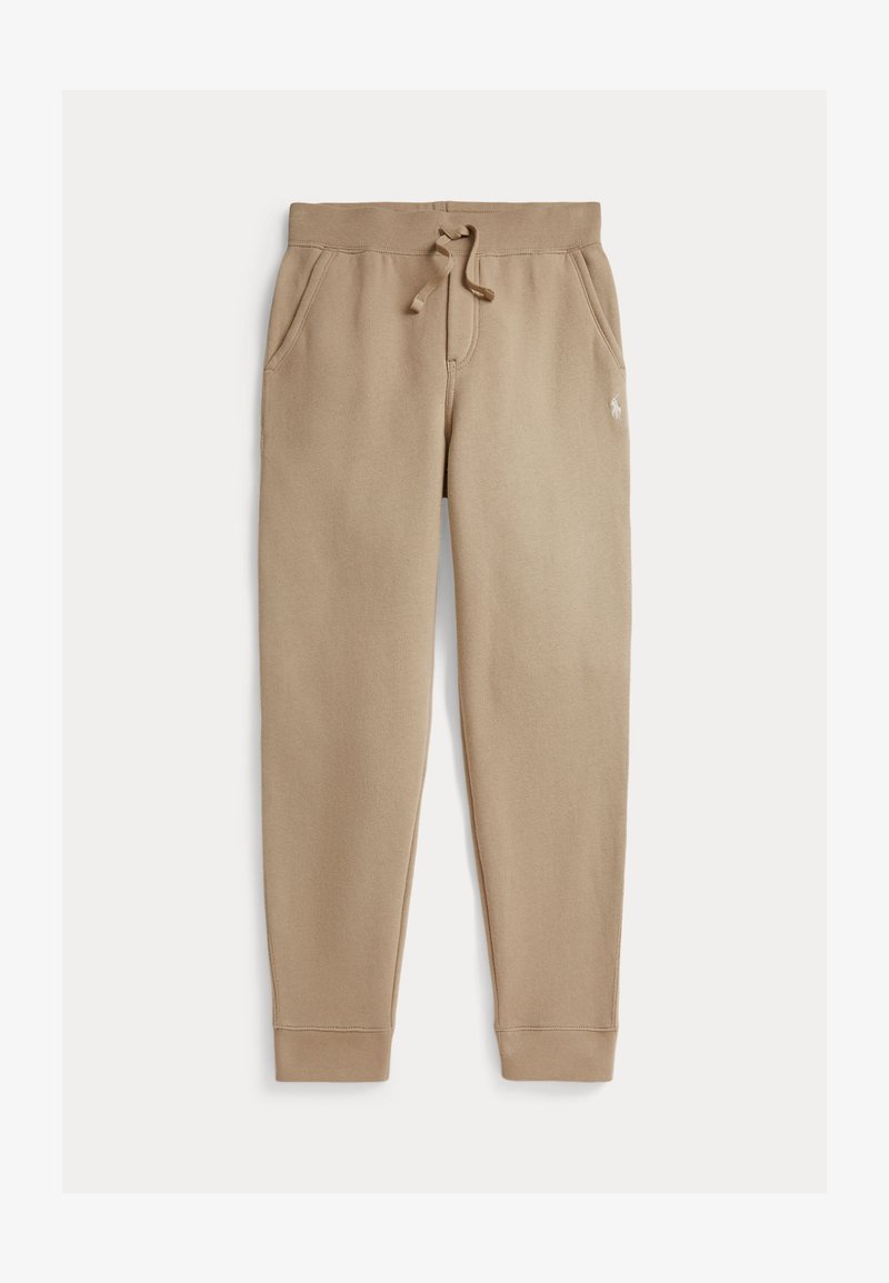 Pantalon de jogging en polaire beige avec taille élastiquée, cordon de serrage, poches latérales, poignets côtelés et petit logo brodé sur la cuisse droite.