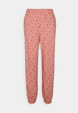 Pantalon de jogging rose à taille élastique avec un motif intégral de petits cercles rouges et de formes ondulées, poignets élastiques et poches latérales.