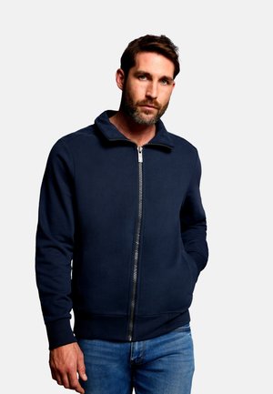 Marineblaue Sweatshirtjacke aus weichem Stoff, mit hohem Kragen, gerippten Bündchen und einem silbernen Reißverschluss mit glattem Abschluss.
