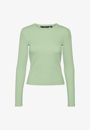 Långärmad topp i ljusgrön ribbad tyg, figurnära design med rundad halsringning, slät struktur och ingen synlig hårdvara eller detaljer.