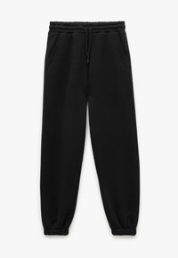 Sorte sweatpants lavet af blødt stof, med elastisk talje, to sidelommer og elastiske manchetter ved anklerne.