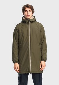Green, insulated parka jacket with a hood, front zip closure, and two side pockets. Features elastic cuffs and a textured collar.