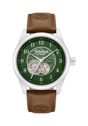 Analogais Timberland automātiskais pulkstenis ar zaļu ciparnīcu, redzamām pārnesuma detaļām, sudraba korpusu un brūnu ādas siksnu, uz kuras iegravēts koka logotips.
