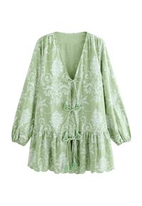 Vaaleanvihreä paita, jossa on kuvioitu design, syvä V-aukko, sidontadetaili edessä ja puffihihat, joissa on aaltoilevat alaosat.