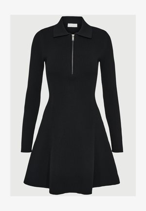 Vestido de punto de manga larga con canalé negro, con cuello, media cremallera en la parte delantera, cintura ajustada y falda acampanada.