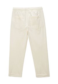 Pantalons cropped beige clair avec une taille élastique, deux poches plaquées au dos, texture lisse et ourlets retroussés.