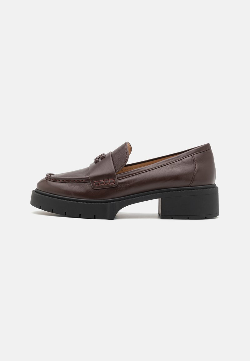 Brown leather loafer with a rounded toe, stitched detailing, and a chunky black rubber heel. Smooth texture and minimal accents.