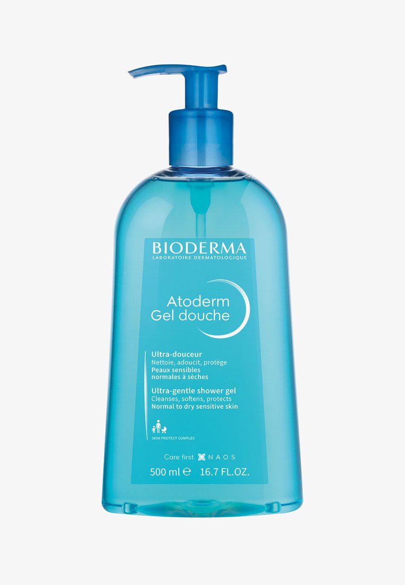 Clear plastic bottle with a blue pump. Contains 500 ml of Atoderm gel. Label features white text detailing product use for sensitive skin.