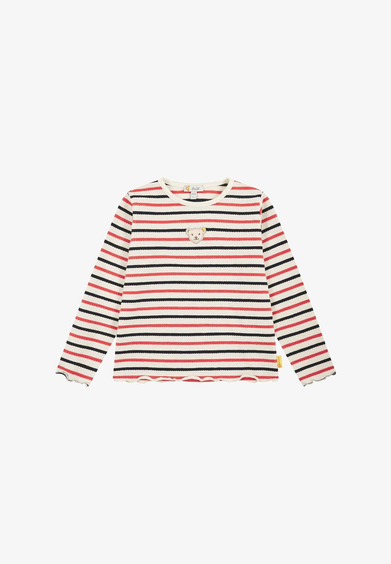 Langarmgestreiftes Hemd in Creme, Rot und Marineblau. Mit einem Bären-Patch auf der Brust und einem rüschensaum. Hergestellt aus ribbeltem Stoff.