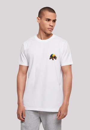 White cotton t-shirt featuring a colorful turtle graphic on the chest. Short sleeves and a crew neckline. Soft texture.
