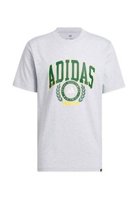 Pilkos spalvos medvilninė marškinėliai, ant kurių užrašytas "ADIDAS" žalia ir geltona spalvomis, su aplinkiniu logotipu ir lauro grafiką centre. Trumpomis rankovėmis, apykaklė su apvaliu iškirpimu.