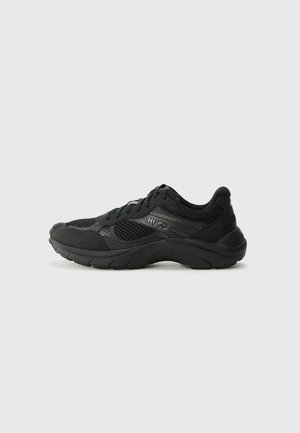 Black athletic shoes featuring a breathable mesh upper, rubber sole, padded collar, and subtle branding on the side.