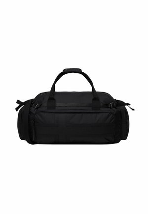 Black duffel bag with reinforced handles, multiple zippered compartments, padded grip, and adjustable side straps for carrying and storage.
