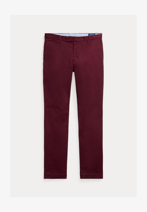Burgundia puuvillased chinos, millel on sile viimistlus, sirge jala disain, vööloopide ja klassikaline eest lukku sulgemine. Esiküljel on logo vöökoha peal.