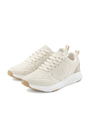 Light beige athletic shoes with a textured finish, lace-up design, molded accents, and a white midsole. Rubber outsole for traction.