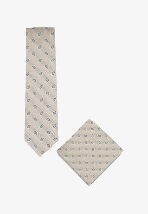 Beige stropdas en bijpassend pochet met een klein blauw-zwart paisley patroon op een gestructureerde stof.