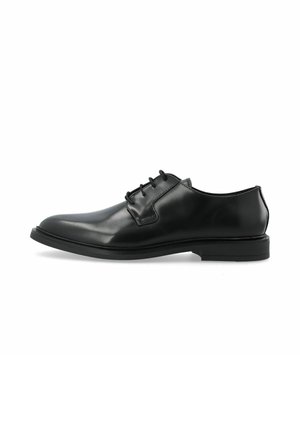 Chaussure oxford en cuir noir avec une finition lisse, un bout rond et un laçage à trois œillets. Dotée d'une semelle en caoutchouc à profil bas.