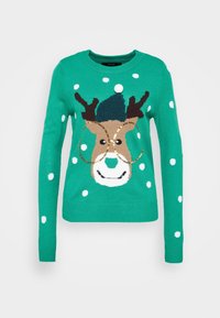 Pull vert en tricot avec un motif de renne aux bois marron, visage blanc et pois. Texture lisse avec un col rond.