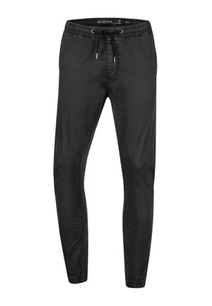 Black jogger pants with elastic waistband, adjustable drawstring, tapered legs, and stitched detailing. Made of soft cotton blend fabric.