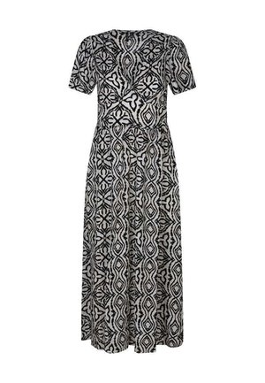 Robe longue à manches courtes à motifs noir et blanc, taille ajustée et design géométrique inspiré des tribus.