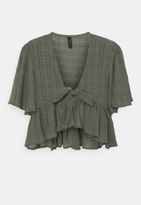 Short-sleeve, olive green blouse with a v-neck, tied front detail, ruffled hem, and a checkered pattern throughout. Lightweight fabric.