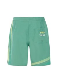 Groene zwemshorts met een gestructureerd mesh zijpaneel, elastische tailleband en een patchzak met "PRO TEST" borduring.
