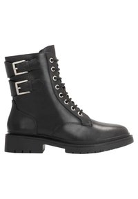 Black leather ankle boots with a rounded toe, lace-up front, and dual silver buckles on the shaft. Thick, textured rubber sole.