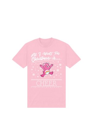 Lyserød bomulds T-shirt med et grafisk motiv af en springende bjørn, hvid tekst der står "Alt jeg ønsker mig til jul er... HUMØR," og snefnugsdetaljer.