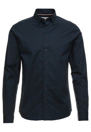 Navyblaues Langarmshirt aus Baumwolle mit Knopfleiste, spitzem Kragen und Kontrastnähten. Verfügt über eine reguläre Passform und ein elegantes Design.