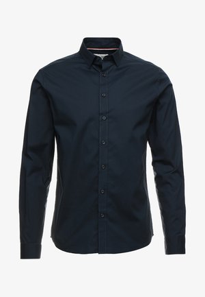 Navyblaues Langarmshirt aus Baumwolle mit Knopfleiste, spitzem Kragen und Kontrastnähten. Verfügt über eine reguläre Passform und ein elegantes Design.