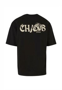 Black cotton t-shirt with short sleeves. Back features large white text "CHAOS" and a swirling graphic. Simple crew neck design.