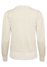 Jasnobeżowy sweter z prążkowanym kołnierzem i mankietami, teksturowanym wzorem dzianiny oraz lekko bufiastymi rękawami. Posiada elastyczny dolny brzeg.