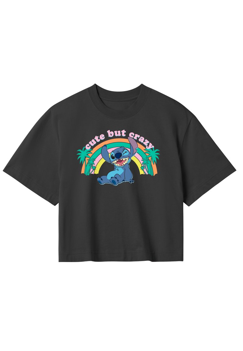Sort oversized t-shirt lavet af bomuld. Har et farverigt grafisk design af en karakter med teksten "sødt men skørt" og palmetræ-accenter.