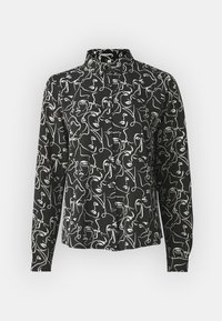Black long-sleeve shirt with white abstract faces pattern, featuring a straight collar and button closure, made from lightweight fabric.