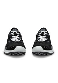Black athletic shoes feature a mesh upper with suede accents, white laces, and a textured white and gray sole. Rounded toe and thick tread.