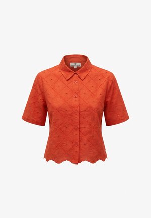 Blouse orange à manches courtes avec boutons, broderie florale en œillets, col pointu et ourlet festonné.