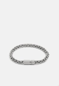 Silver chain bracelet with intertwined links, featuring a textured, cylindrical clasp. Smooth, shiny metal finish.