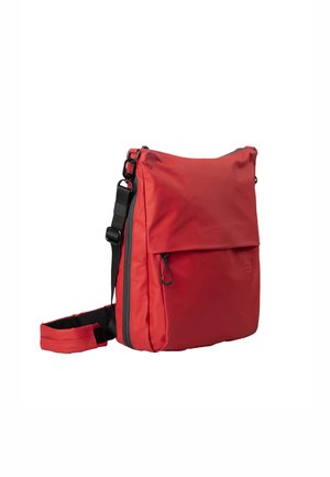 Red crossbody bag with adjustable black strap, front zip pocket, and flap closure, isolated on white background.