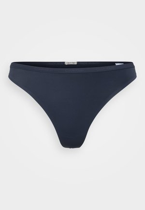 Tumesinine bikiinipüks talje, mis on valmistatud siledast kangast, madala lõikega disainiga, bränditud vöökohaga, millel on peen logo detail.