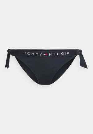Zwarte bikinionderkant met gestrikte zijkanten. Voorzien van een contrasterend wit logo op de tailleband. Gemaakt van glad, rekbaar materiaal.