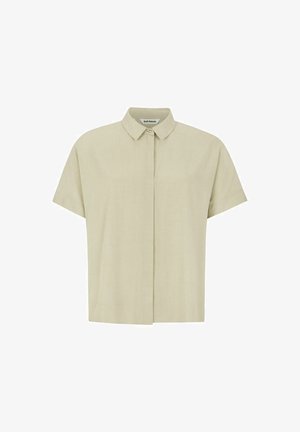 Rövid ujjú, galléros ing világoszöld anyagból. Gombos elülső záródás, laza fazon, sima textúra, minimális díszítés.