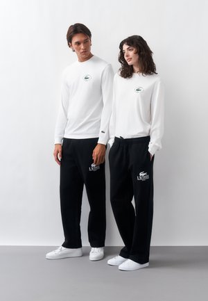 Lacoste, UNISEX - Pantalones deportivos - black
