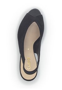 Black suede wedge sandal with an open toe, cut-out design, and a smooth insole featuring gold brand lettering.