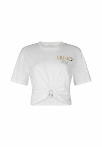 T-shirt blanc court en coton, avec un détail de nœud à l'avant, impression logo doré et manches courtes. Design plat sans motifs.