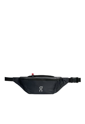 Black fanny pack with durable fabric, zippered compartments, and adjustable strap. Features a prominent logo on the front and a textured surface.